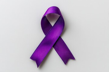 Top view of a white background with a purple ribbon for awareness