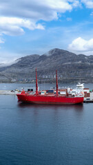 International shipping line transportation container cargo ship in Nuuk Port in Greenland