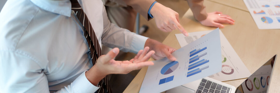 Asian adult business professionals hands analyze data charts graphs laptop office meeting strategy - Powered by Adobe