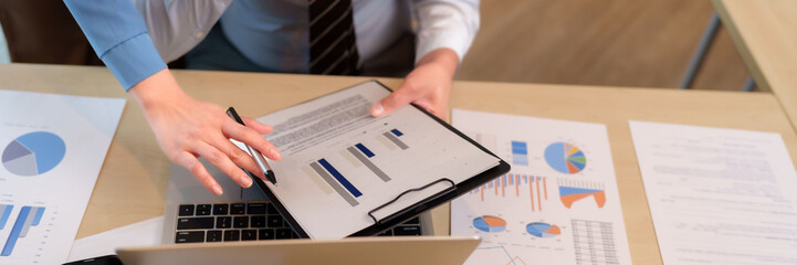 Business team hands analyze financial data charts reports strategic meeting discussion office