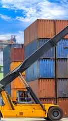 Busy international industrial port with freight and shipment docks and cargo containers.