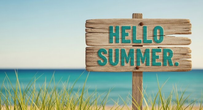 Rustic Hello Summer Sign on Beach with Turquoise Water Backdrop.