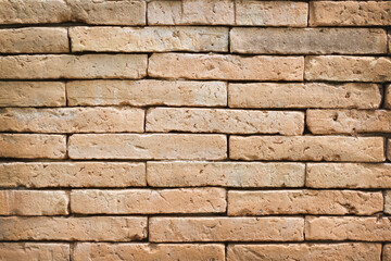 Brown brick fence wall closeup  background