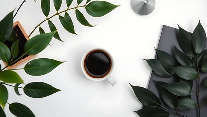 Minimalist desk with coffee cup and plant leaves, showcasing a clean and organized workspace.