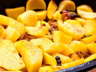 Stewed potatoes with tender meat create a delicious comfort food experience in a rustic kitchen setting