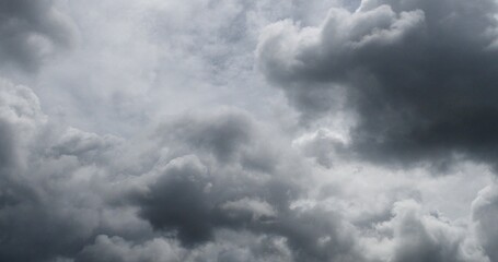 Dark rain cloud dramatic sky summer tropical thunder storm sky and fluffy black darkness cloud...