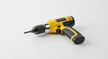 Yellow and black cordless drill on a white surface