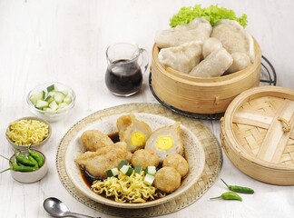 Pempek or mpek-mpek is a delicacy from Palembang, South Sumatra. It is made of fish and sago flours and served together with a dark, rich sauce called cuko.