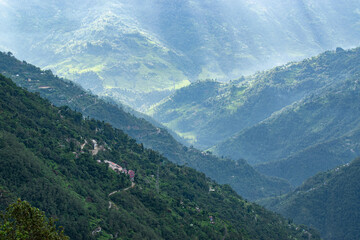 Beautiful Sun rays falling on Himalayan mountain range, play of light, scenic beauty of Okhrey, sikkim, India. Okhrey village a remote place in Sikkim where mountain range view is enjoyed by tourists.