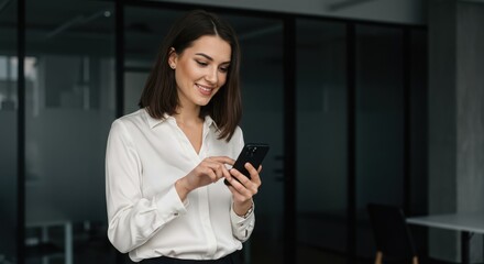 Photo of woman using smartphone in office