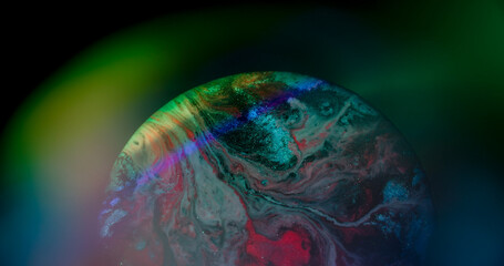 Sparkling wave. Neon bokeh. Defocused pink purple green color round paint glitter particles...