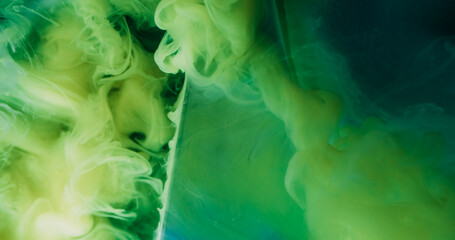 Swirling cloud. Color water. Defocused green blue paint in liquid geometric vapor on abstract...