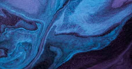 Paint fluid blend. Flowing ink. Defocused blue purple color chemical particle purple water floating...