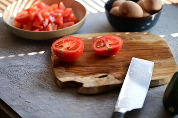 sliced tomato and knife