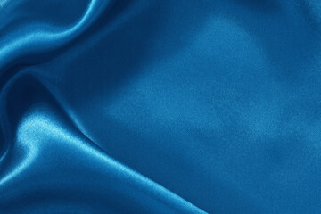 Blue fabric cloth texture for background and design art work, beautiful crumpled pattern of silk or linen.