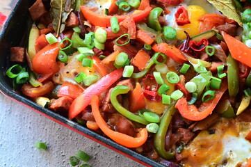 Traditional Czech Lecsó with Sausage, Egg, and Peppers – Close-Up of Rustic One-Pot Summer Meal...