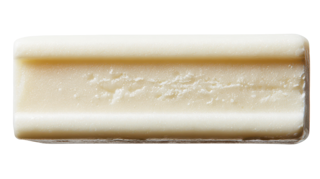 A rectangular piece of creamy white soap on a clean surface. transparent background
