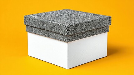Square gift box with gray fabric top.