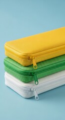 Vibrant Stacked Storage Cases with Zippers on Blue Background