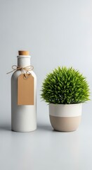 White Bottle with Blank Brown Tag and Small Green Plant Minimalist Still Life on Light Grey Background