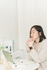 asian business and writer woman smile and happy during think new idea and meeting online