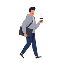 A young man carrying a laptop and coffee cup, walking confidently.
