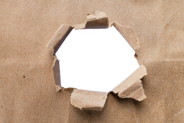 The torn kraft brown paper was and has a hole in the middle.