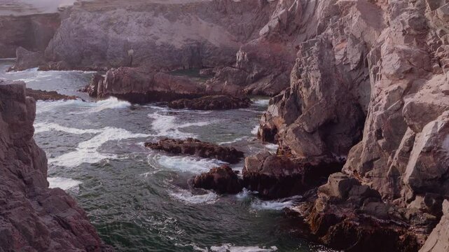View of the cliff and the Pacific Ocean, located in the Quebrada Honda cove, Arequipa.