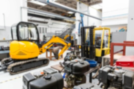 Defocused image of eath mover and machinery