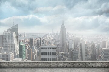Flat design showing Manhattan skyline rising above concrete rooftop railing with river © vectorfusionart