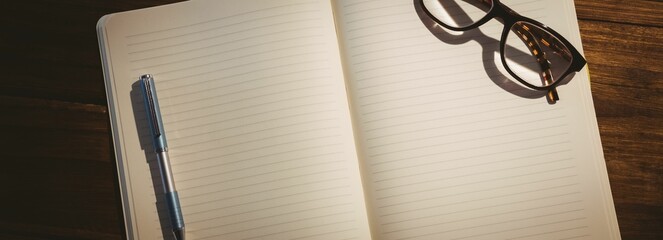 Open book on wooden table