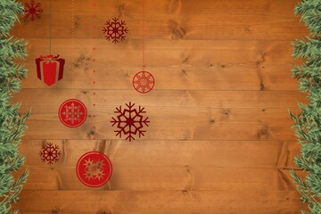 Christmas baubles in front of wood