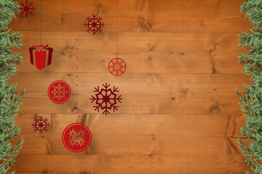 Christmas baubles in front of wood