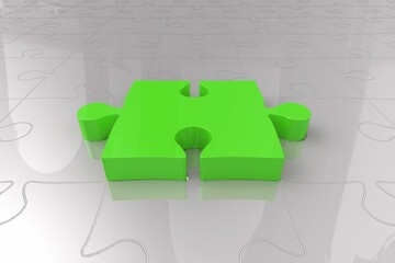 3D glossy green jigsaw puzzle piece is resting on reflective metal surface with puzzle grooves
