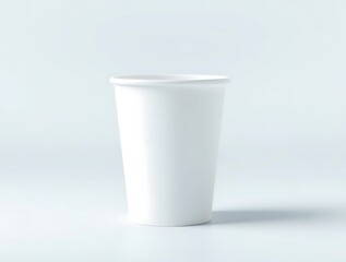 Clean white disposable cup casting shadow against seamless backdrop