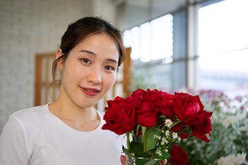 Young entrepreneurs are working at florist shop.