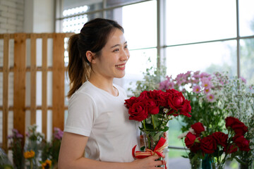 Young entrepreneurs are working at florist shop.