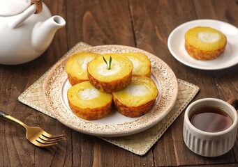 Kue lumpur. Mud cake is a snack made from coconut milk, potatoes, wheat flour and eggs as the main ingredients.
