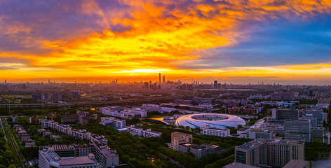 Fototapeta premium Panoramic aerial view of Shanghai Zhangjiang Hi Tech Development Zone at sunset, with beautiful flame clouds.