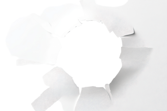 Circular hole in white paper background revealing soft texture and torn edges, highlighting the contrast between damage and untouched surface