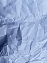 Textured Paper: A close-up shot of crumpled paper, showcasing its intricate textures and subtle shadows, offering a unique aesthetic. 