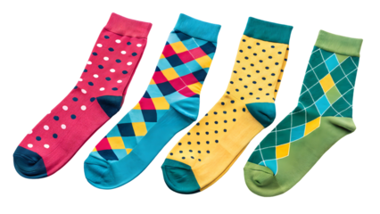Four colorful patterned socks with polka dots and argyle designs isolated on a transparent background