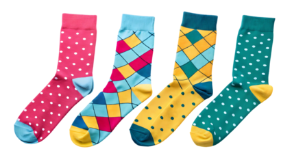Four pairs of colorful patterned socks with polka dots and argyle designs isolated on a transparent background