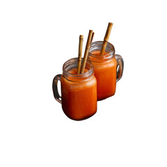 Two Mason Jars of Refreshing Orange Smoothie with Bamboo Straws
