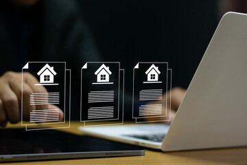 Businessman doing property management documents online with house icon and digital residence contract. Investment planning, transaction management.