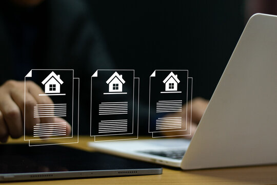 Businessman doing property management documents online with house icon and digital residence contract. Investment planning, transaction management.