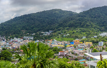 view of Patong and Patong Beach from the mountains colourful skies at Sunset. Patong is a vibrant city full of tourists from all around the world. 