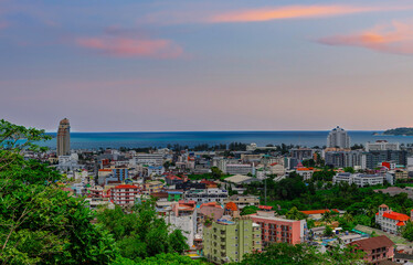 view of Patong and Patong Beach from the mountains colourful skies at Sunset. Patong is a vibrant city full of tourists from all around the world. 