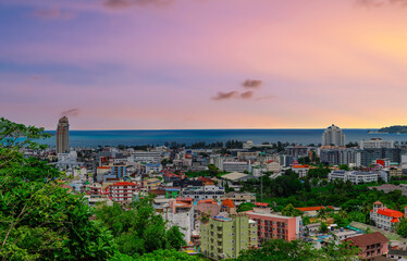 view of Patong and Patong Beach from the mountains colourful skies at Sunset. Patong is a vibrant city full of tourists from all around the world. 