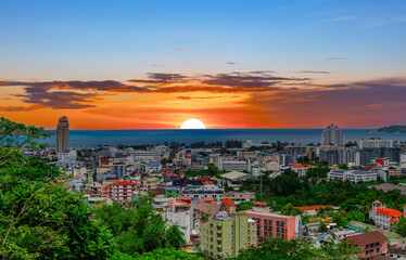 view of Patong and Patong Beach from the mountains colourful skies at Sunset. Patong is a vibrant city full of tourists from all around the world. 